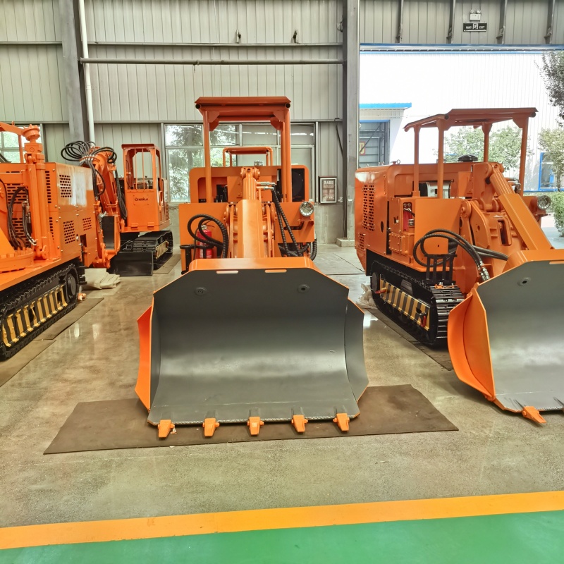 Cargador de rocas de descarga lateral